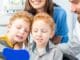 Friendly pediatric dentist and assistant at Diamond Dental Arts in Punta Gorda caring for young patients